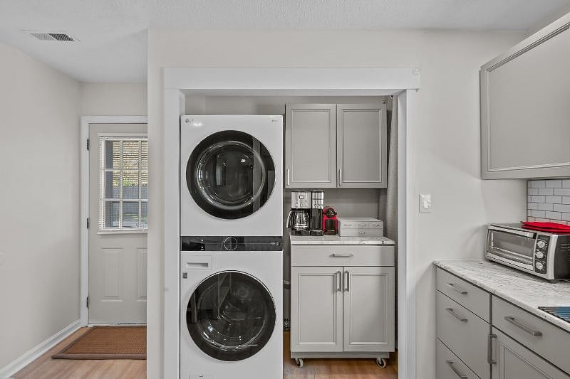 Full size washer/dryer and coffee bar with full size carafe, K-cups and Nespresso machine. 
