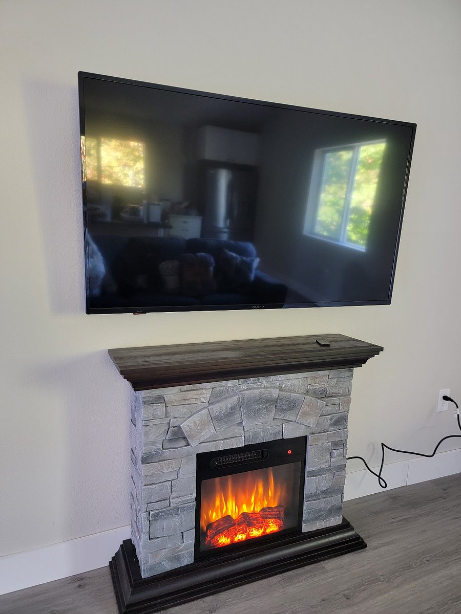 Electric fireplace is not only cozy but is a nice heat source.