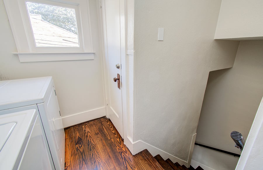Stairwell down to back entry. Door to third level retreat stairwell