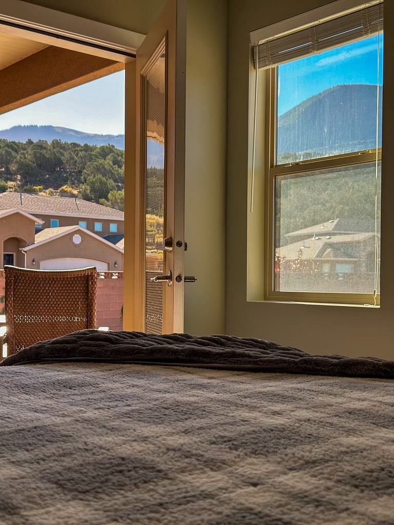 Good morning Cedar Mountain! Master bedroom - invigorating view and access to outdoor living space.