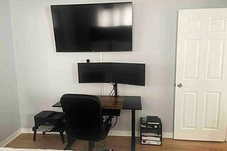 stand up desk with 2 monitors - currently in the livingroom, but can be moved to the room