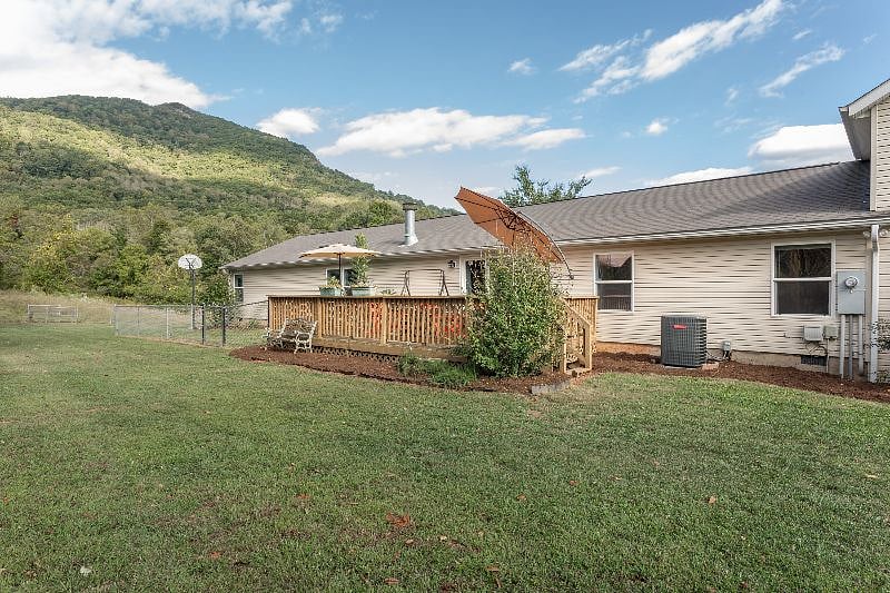 Back of the house showing your back porch. "Our Teacup Yorkie really made herself at home and loved it too"