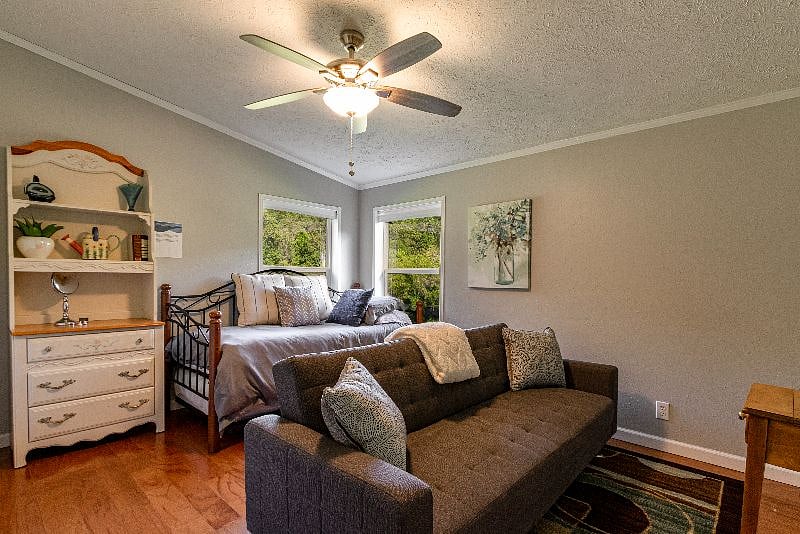 The 4th Bedroom sleeps 3 has a twin with trundle bed and a twin chair sofa. All bedrooms on the lower level have ceiling fans. This is usually the preferred kids room. There are plenty of games, books and seperate TV with DVDs to entertain them.