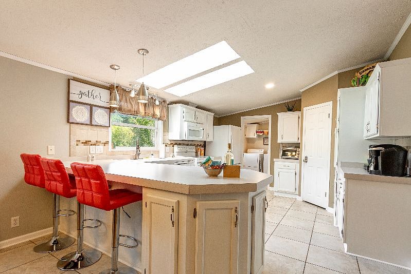 Cook your dinners in the large bright kitchen with sky lights. We have stove, oven, toaster oven, refrigerator with ice/water, crockpot, blender, spices,dishes, pots and pans even dishes for the kids. There is a full washer/dryer with detergent.