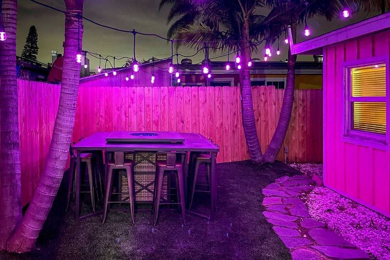 Super private backyard dining area for eight.  With propane fire-pit table. With additional outdoor lighting as well as normal flood lighting. 
