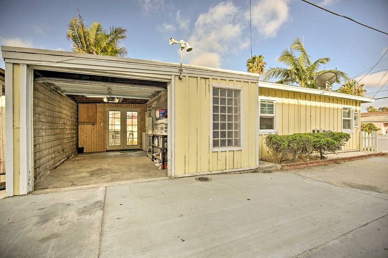 Garage with brand new Modern phone activated Samsung washer and dryer and full EV/Tesla charging station. 