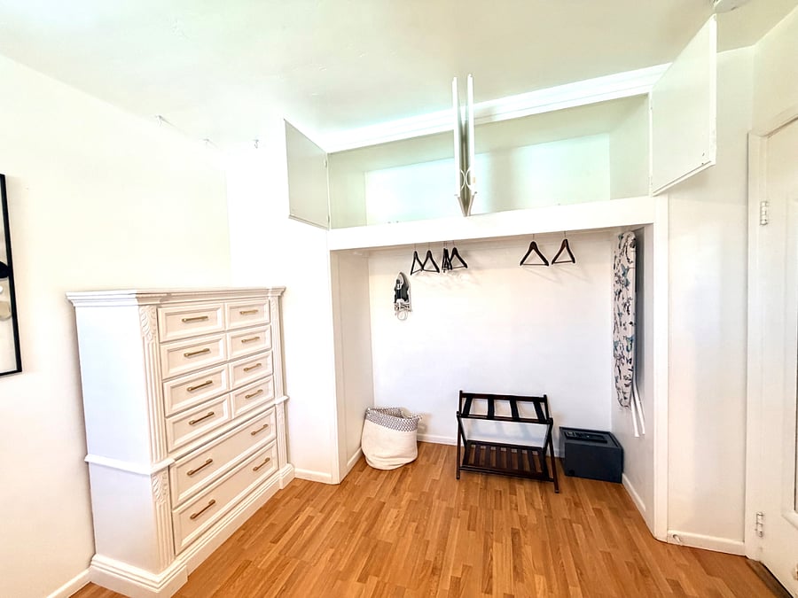 Large open closet with tons of overhead storage. 