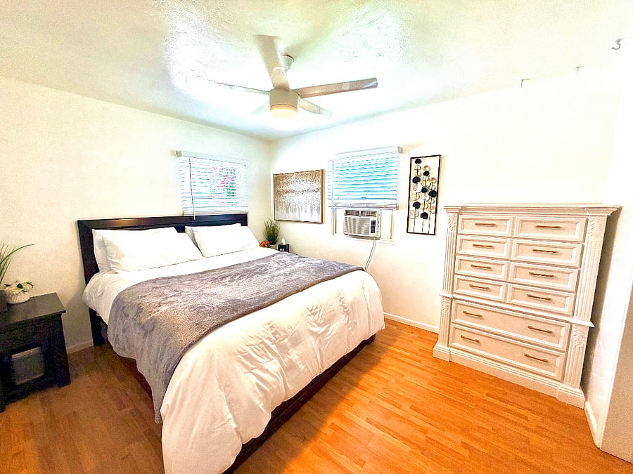 Gorgeously equipped Master bedroom with a huge California King bed and an oak hardwood extra large dresser. 