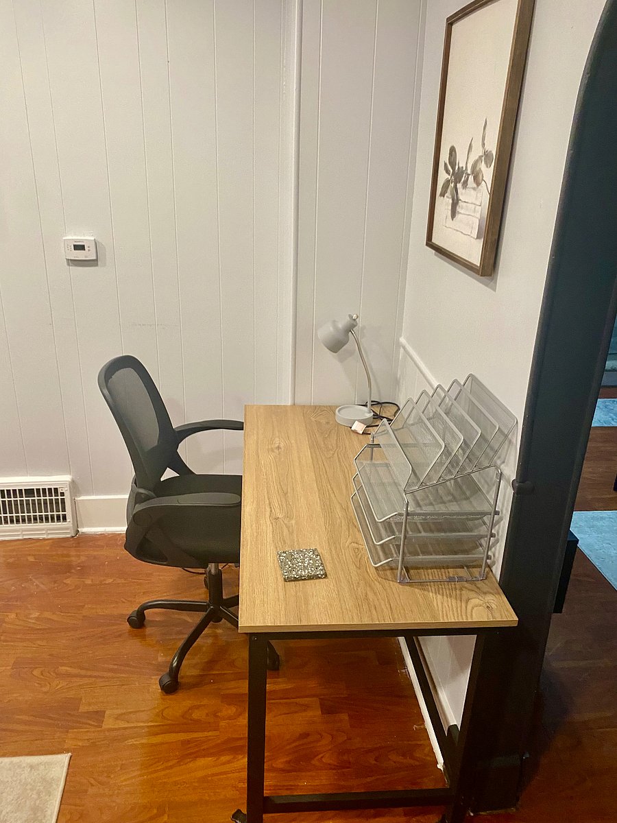 Workspace desk located in the dining area. Table and chair has wheels and can be moved around for your convenience.