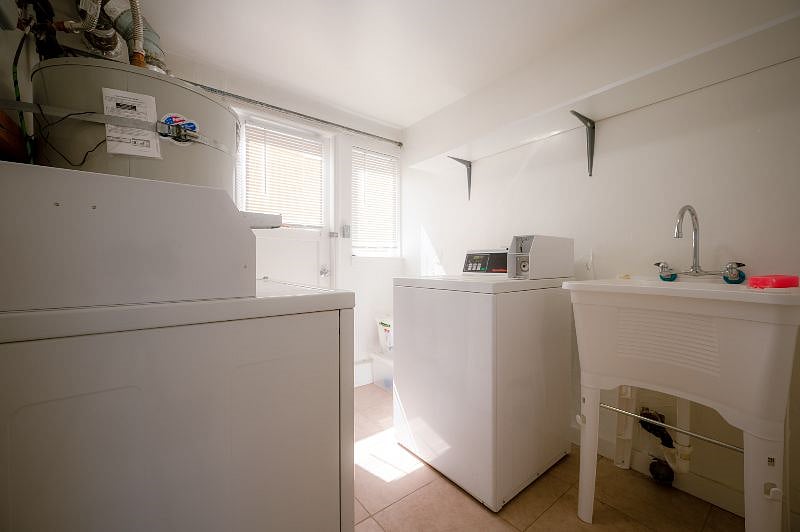 shared laundry in the building near the covered parking