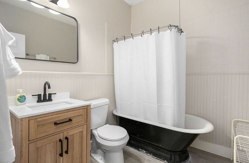 Renovated full bathroom with clawfoot tub/shower combo