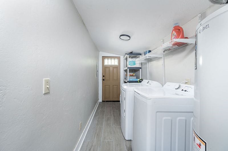 Large laundry room with extra storage/supplies