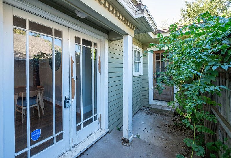 Private side yard with access from dining room and kitchen