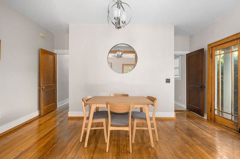 Dining Room connects to kitchen and hallway with bedrooms and office