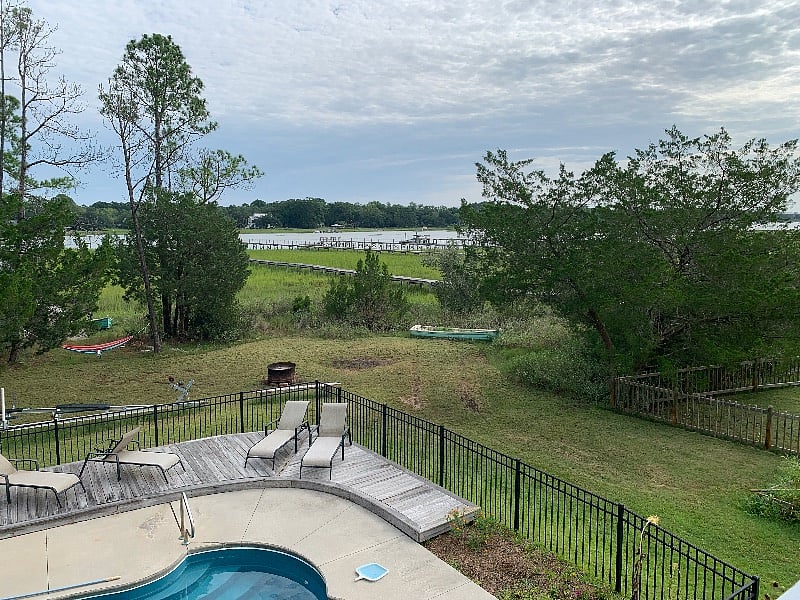 600 sq ft porch overlooking pool and Clarksound.