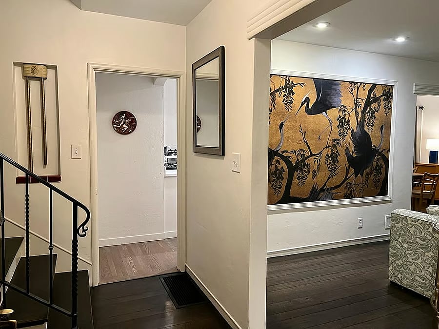 Distributing foyer or entry way. Upstairs to the night area, front to the kitchen and right to the living/dining rooms. 