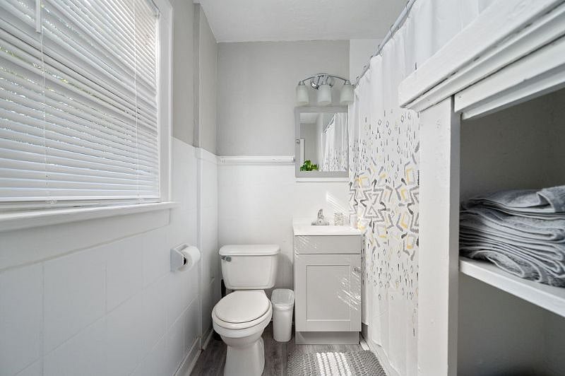 Bathroom with tub and shower are connected to bedroom