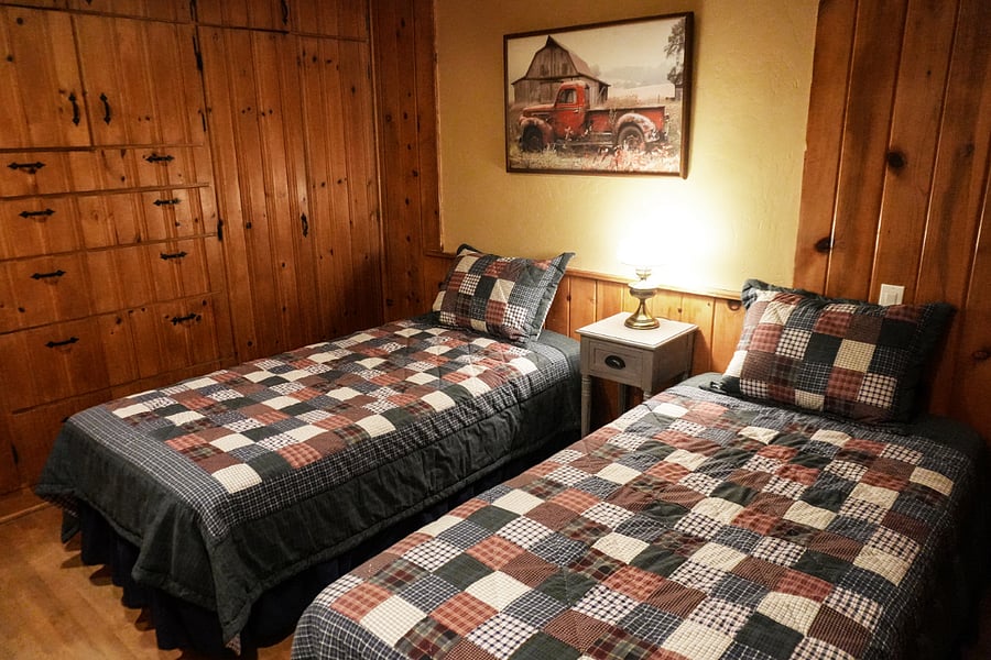 Back bedroom with built in dressers and closets