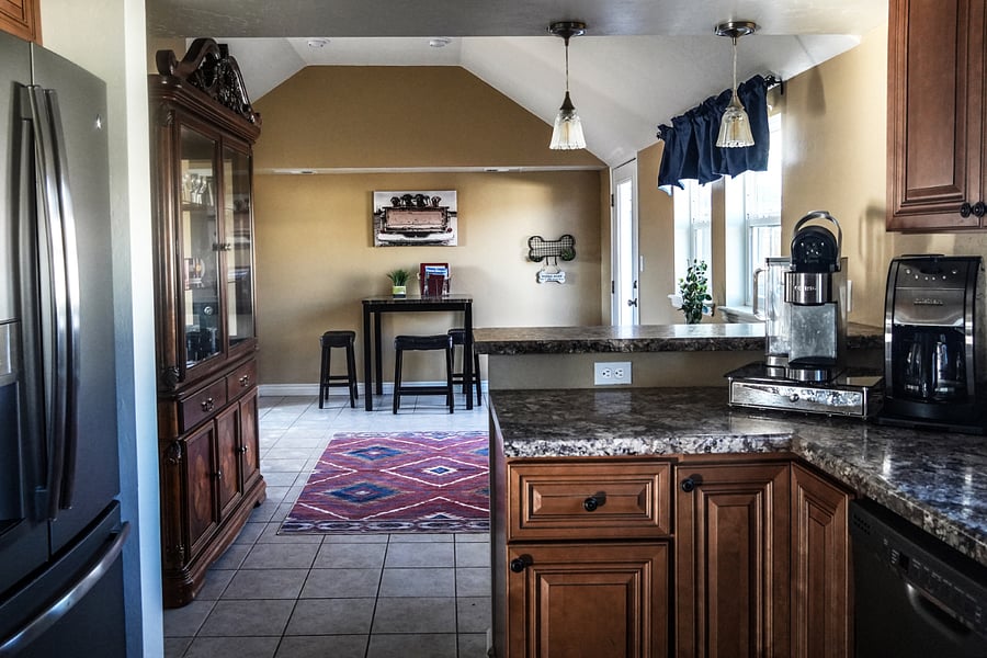 Main entrance from the driveway, access to back patio, breakfast room table.