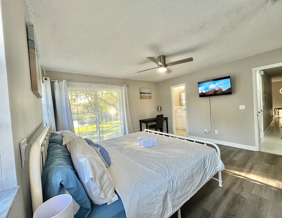 Master bedroom with smart TV, private bath and direct water access.