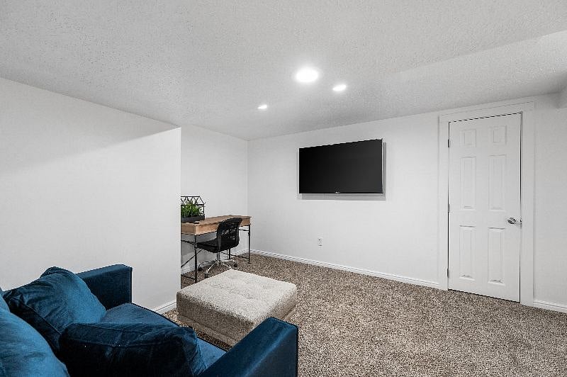 Family room with desk and TV
