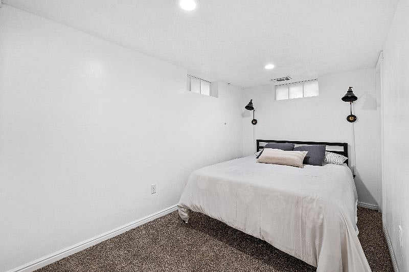 Queen bedroom in basement
