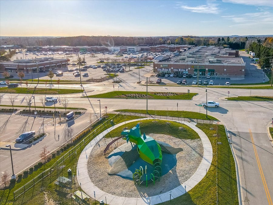 Aerial view of playground and shopping plaza.