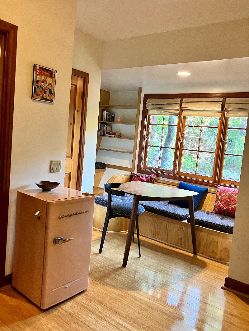 small refrigerator and table