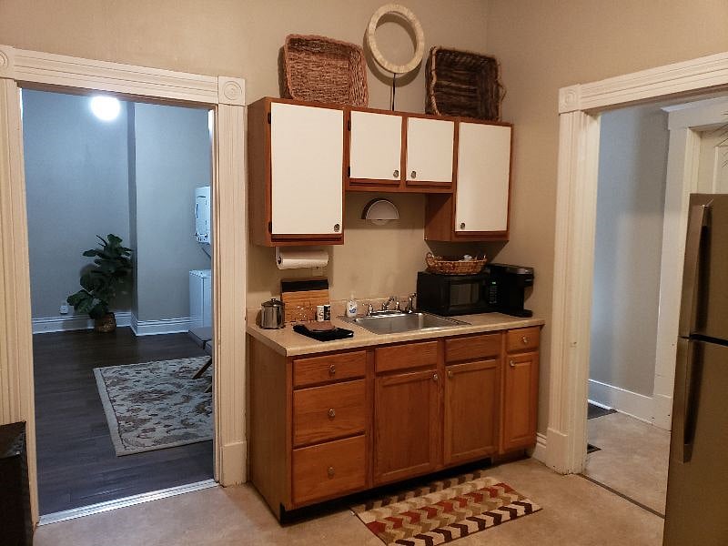 Separate kitchen area off of bedroom/family room