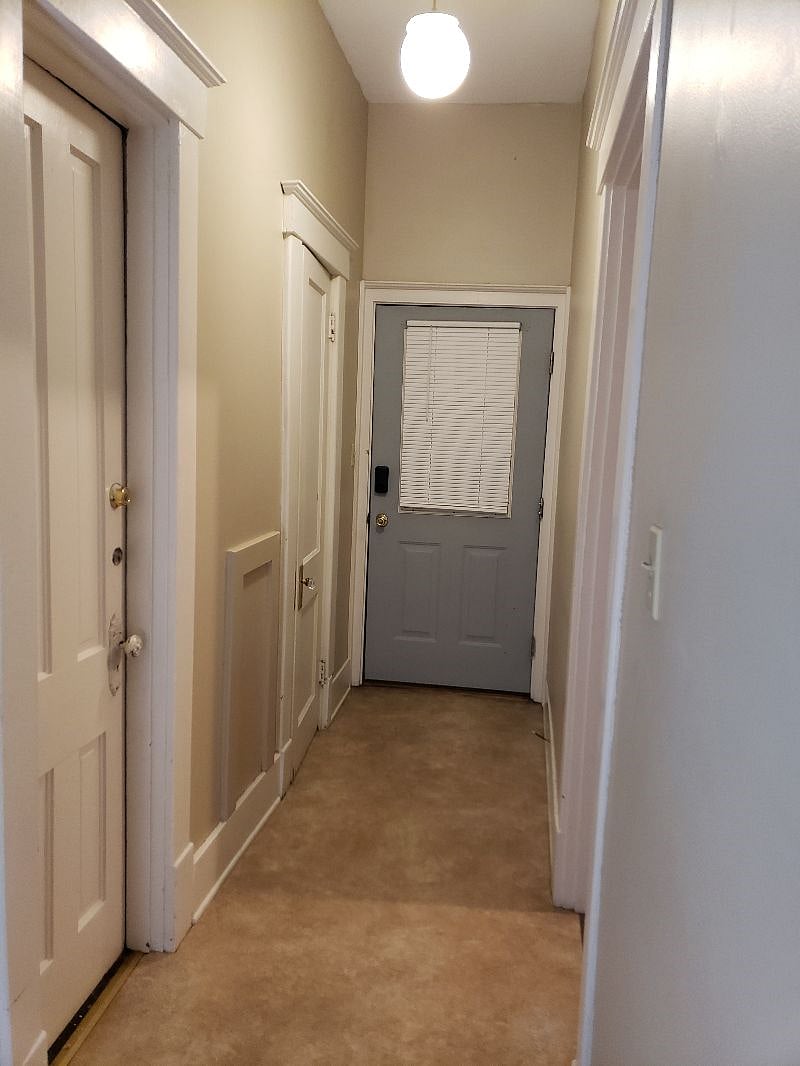 Hallway to bathroom and backdoor/yard