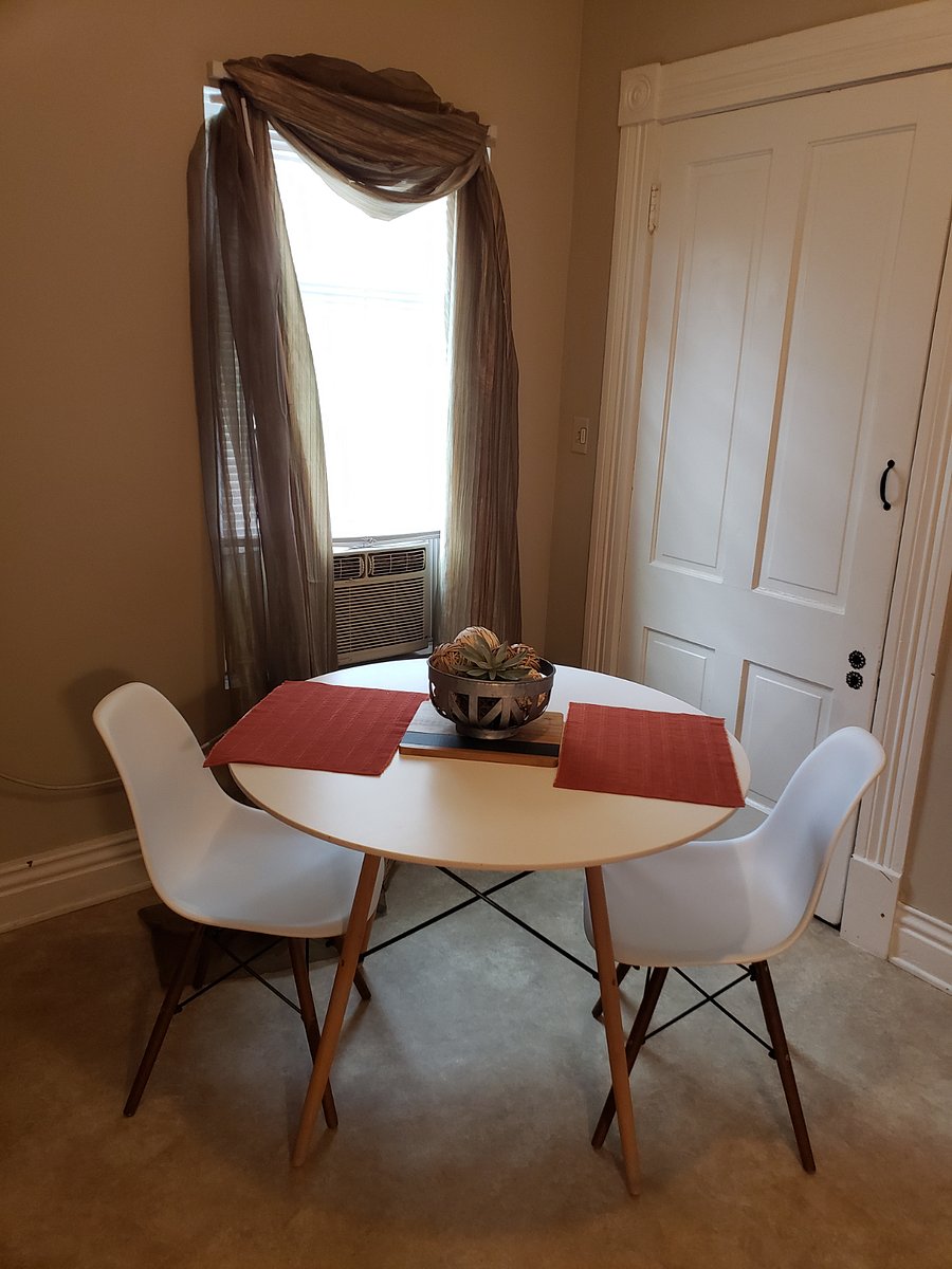Dining area in separate kitchen.  
Large pantry with shelves for ample storage.