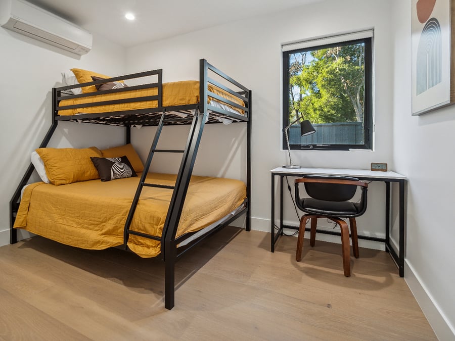 Second bedroom w/twin bed above and full size bed below.