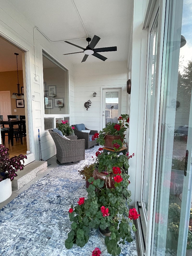 The four-season sunroom is a perfect location for a morning drink.  
