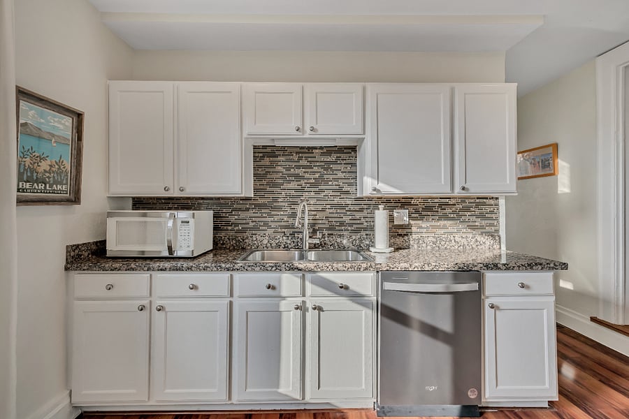 Kitchen with full appliances - stove, fridge, dishwasher, plates, cutlery, even a Vitamix and crepe maker!