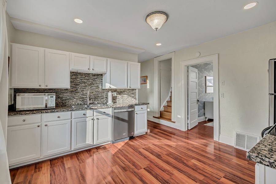 Kitchen with full appliances - stove, fridge, dishwasher, plates, cutlery, even a Vitamix and crepe maker!