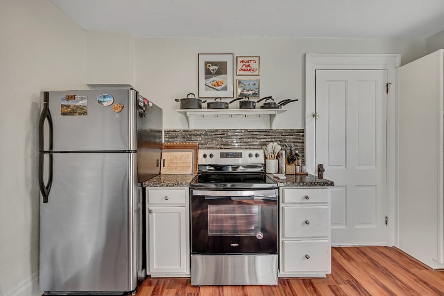 Kitchen with full appliances - stove, fridge, dishwasher, plates, cutlery, even a Vitamix and crepe maker!