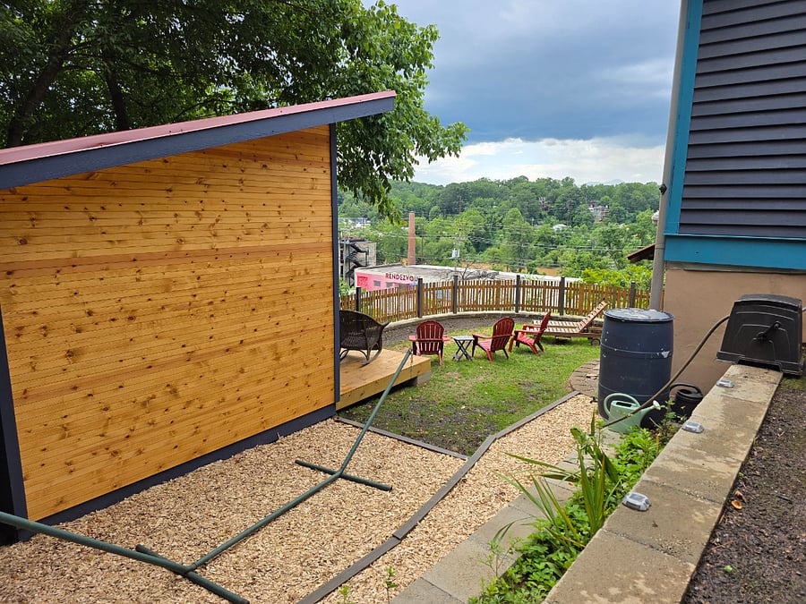 Backyard w chairs and hammock area.