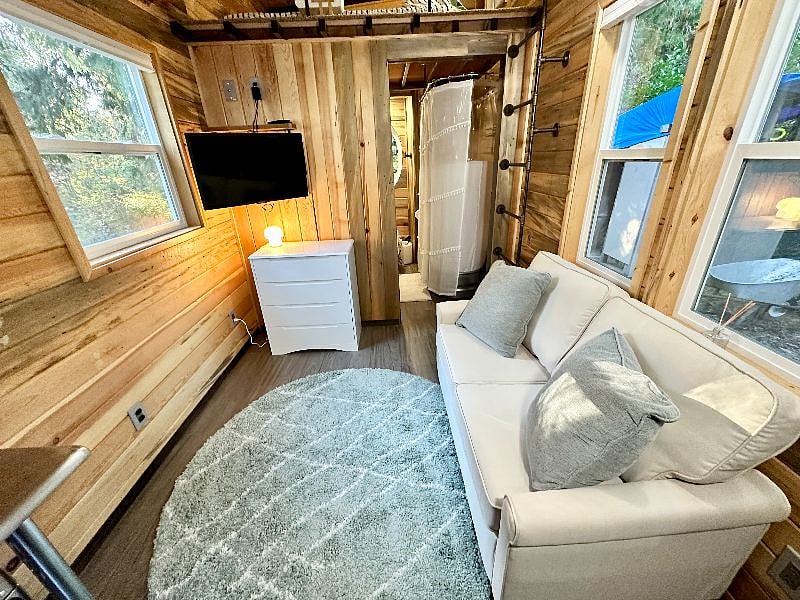 The couch pulls out to a full size bed for guests or people who don't want to use the lofted bed.