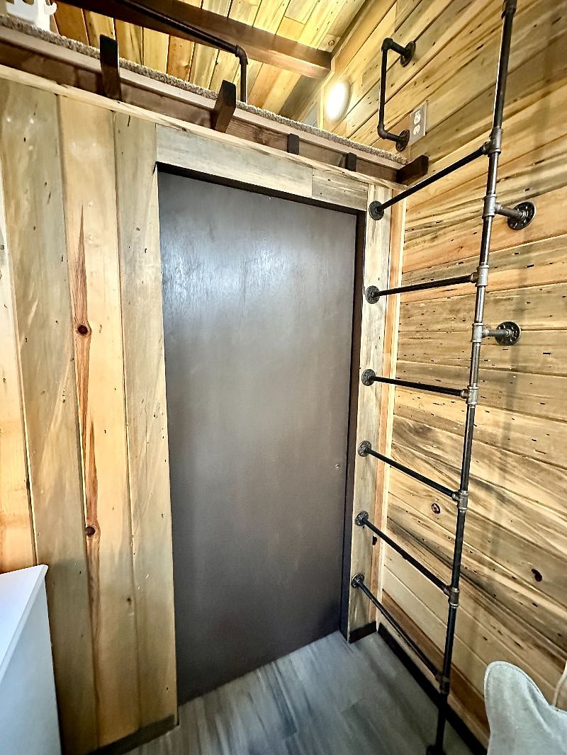 The bathroom has a pocket door.