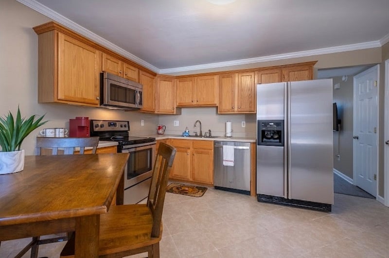 Fully stocked kitchen with dishwasher a full size pantry.