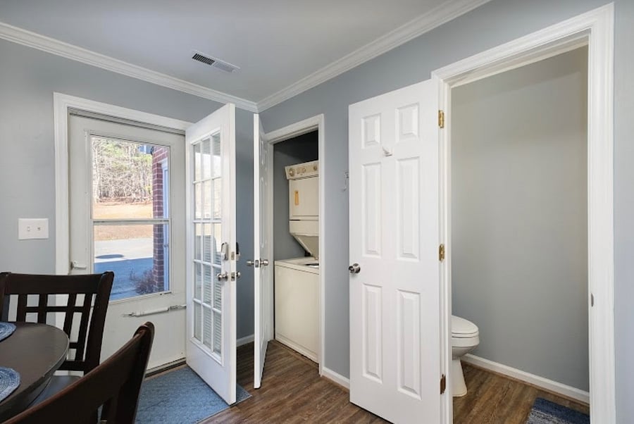 Stackable washer and dryer off kitchen as well as a convenient 1/2 bathroom.