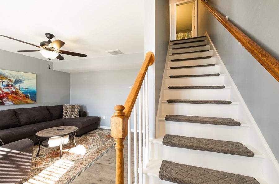 Stairs take you to the second floor to the full bathroom and two bedrooms.