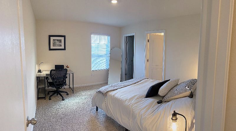 Bedroom 2 with private bathroom and walk in closet with storage