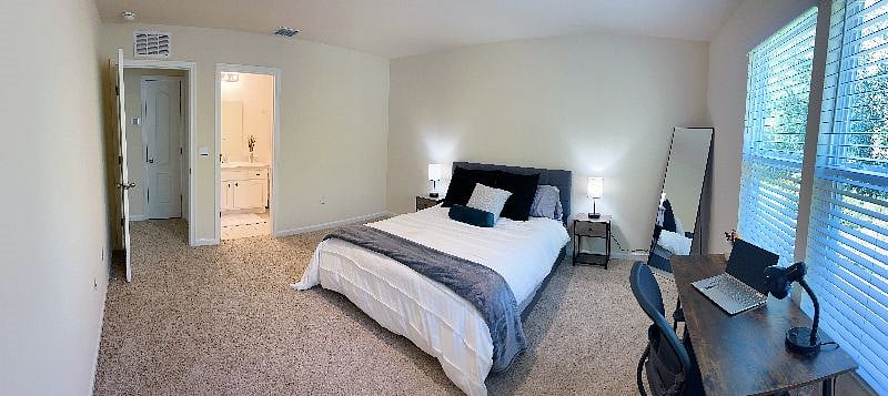 Bedroom 1 with private bathroom and walk in closet with storage