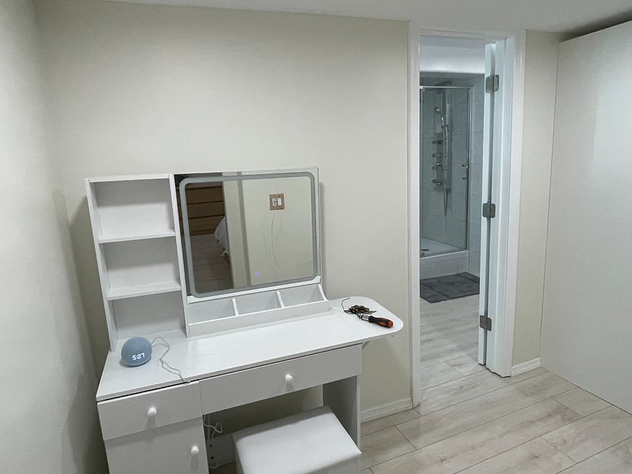 Makeup station between bedroom and bathroom