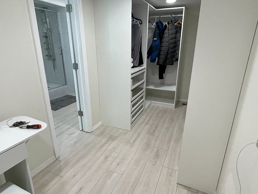 Walk in closet with lots of organized space
