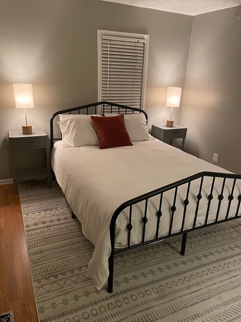Master bedroom with plush queen bed
