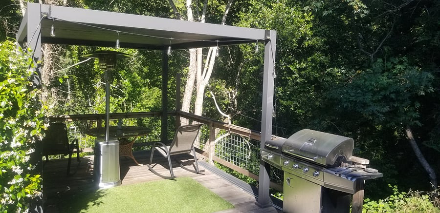 Pergola (shaded) with seating above the river.