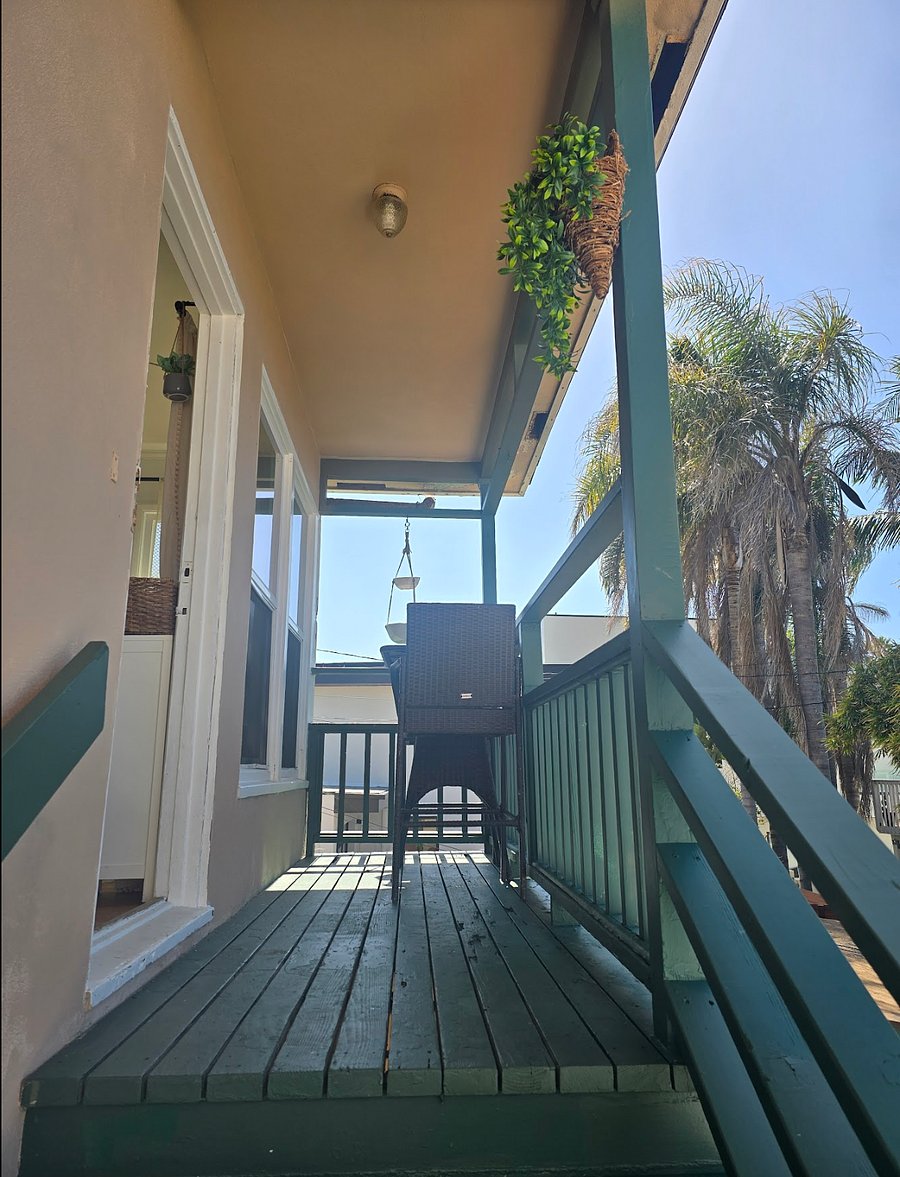 Outside seating overlooking the ocean and garden