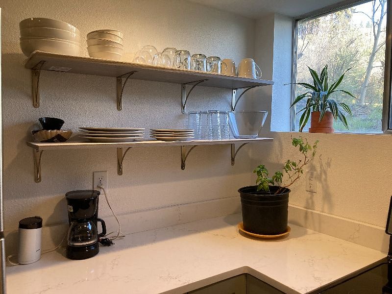 Fully stocked kitchen with dish ware and cook ware